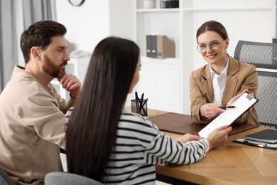 Couple having meeting with lawyer in office