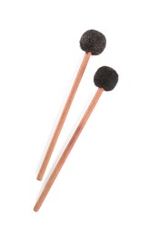 Photo of Wooden bass drumsticks on white background, top view