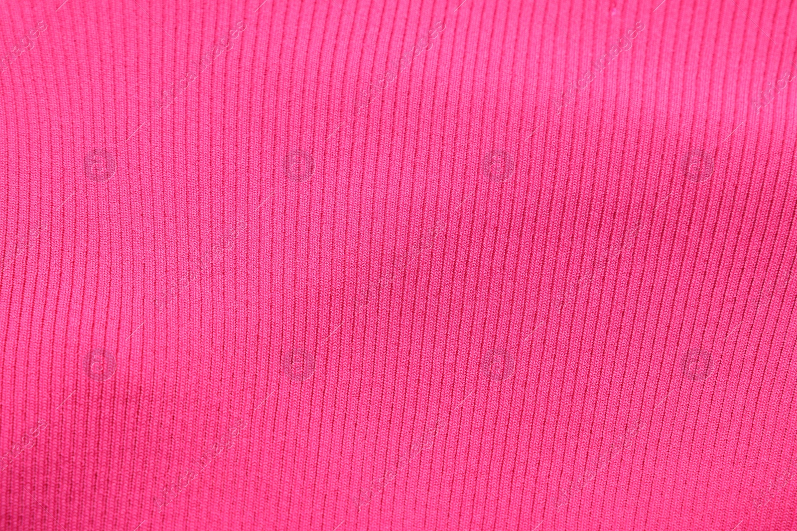 Photo of Texture of pink fabric as background, top view