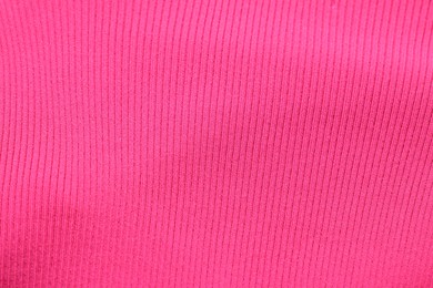 Photo of Texture of pink fabric as background, top view