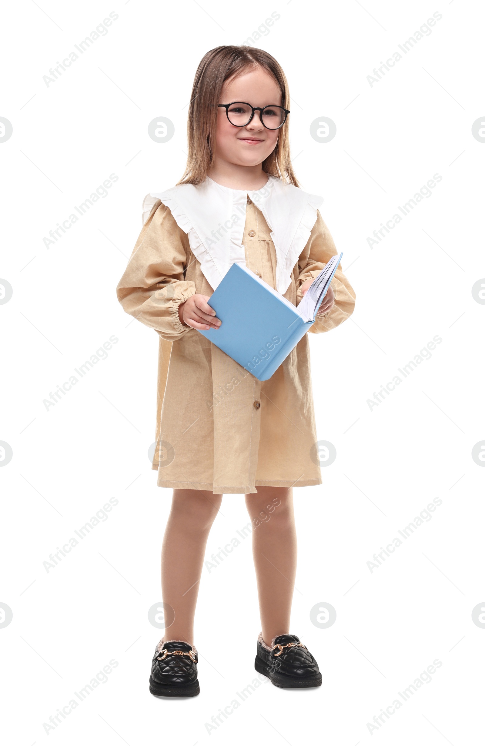 Photo of Cute little girl in glasses with open book on white background