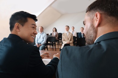 Photo of Business people having discussion in conference room