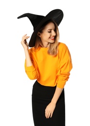 Beautiful young woman wearing witch costume for Halloween party on white background