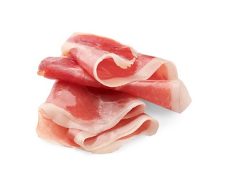 Slices of delicious jamon on white background