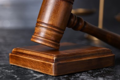 Photo of Law concept. Judge's gavel on dark table, closeup