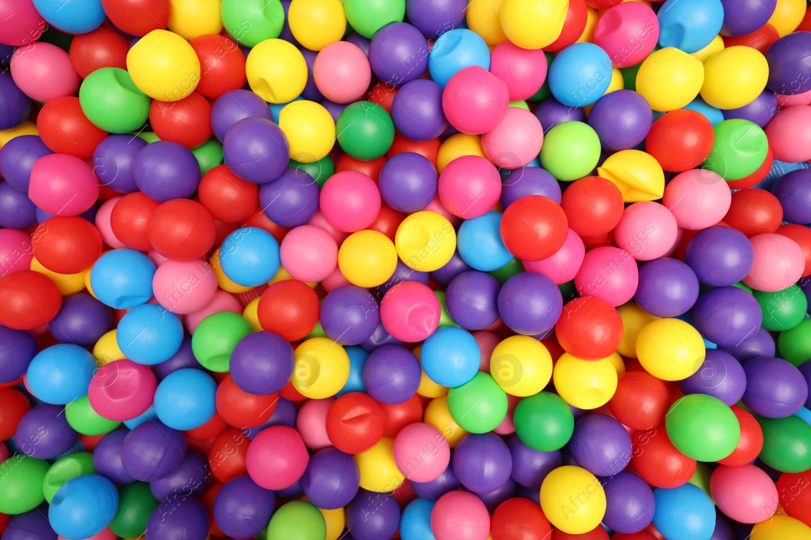 Photo of Many colorful balls as background, top view