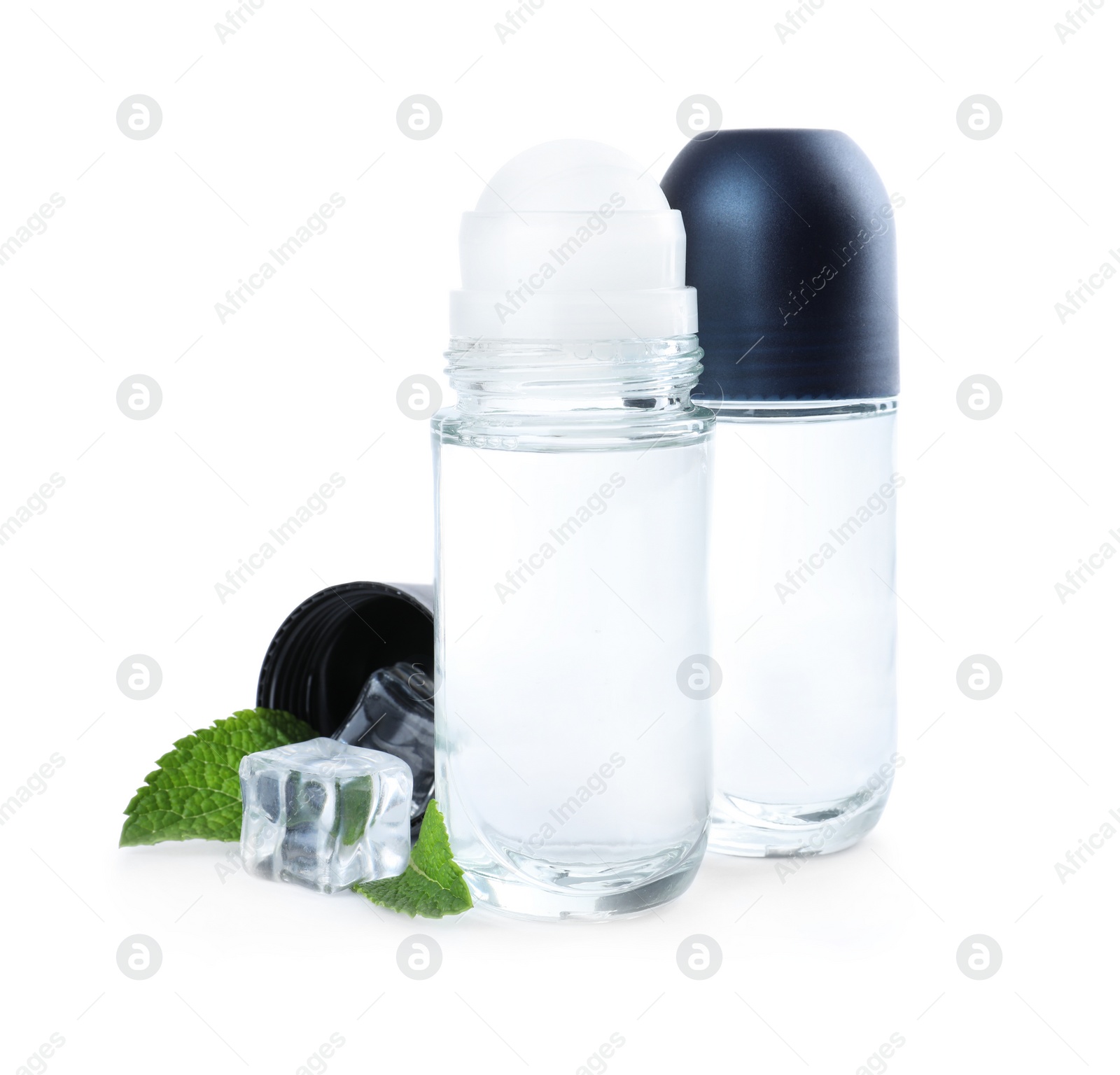 Photo of Natural male roll-on deodorants with ice and mint on white background. Skin care