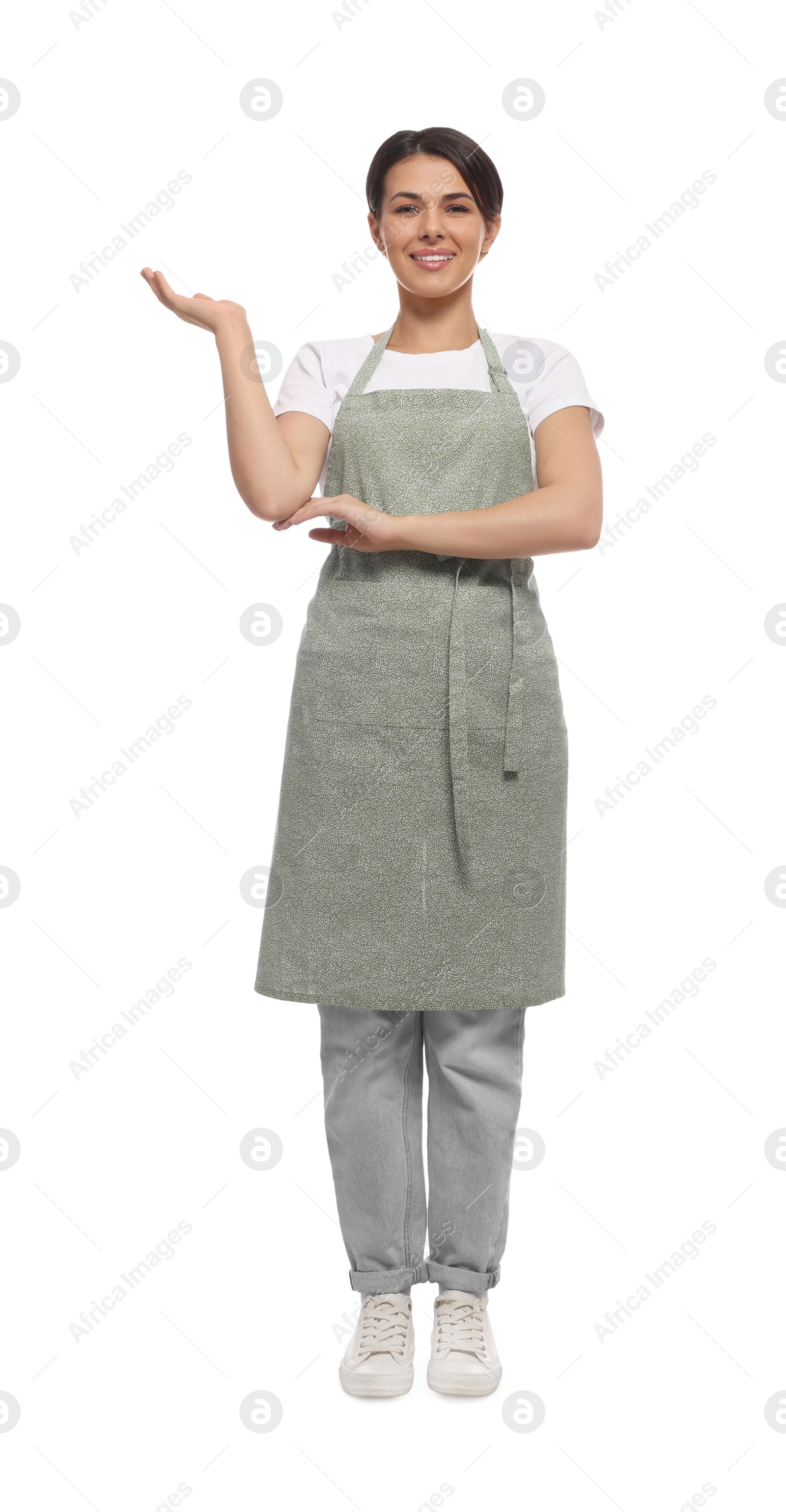 Photo of Young woman in green apron on white background