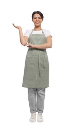 Photo of Young woman in green apron on white background