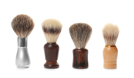 Photo of Shaving brushes for men on white background