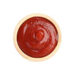 Photo of Tasty ketchup in wooden bowl isolated on white, top view. Tomato sauce