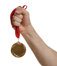 Photo of Man holding golden medal on white background, closeup. Space for design