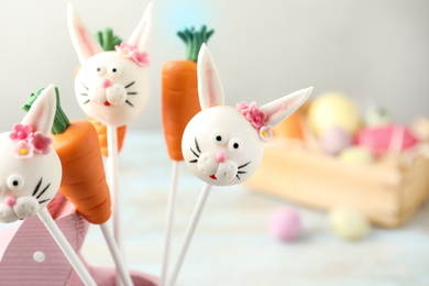Photo of Delicious sweet cake pops on light background, closeup. Easter holiday