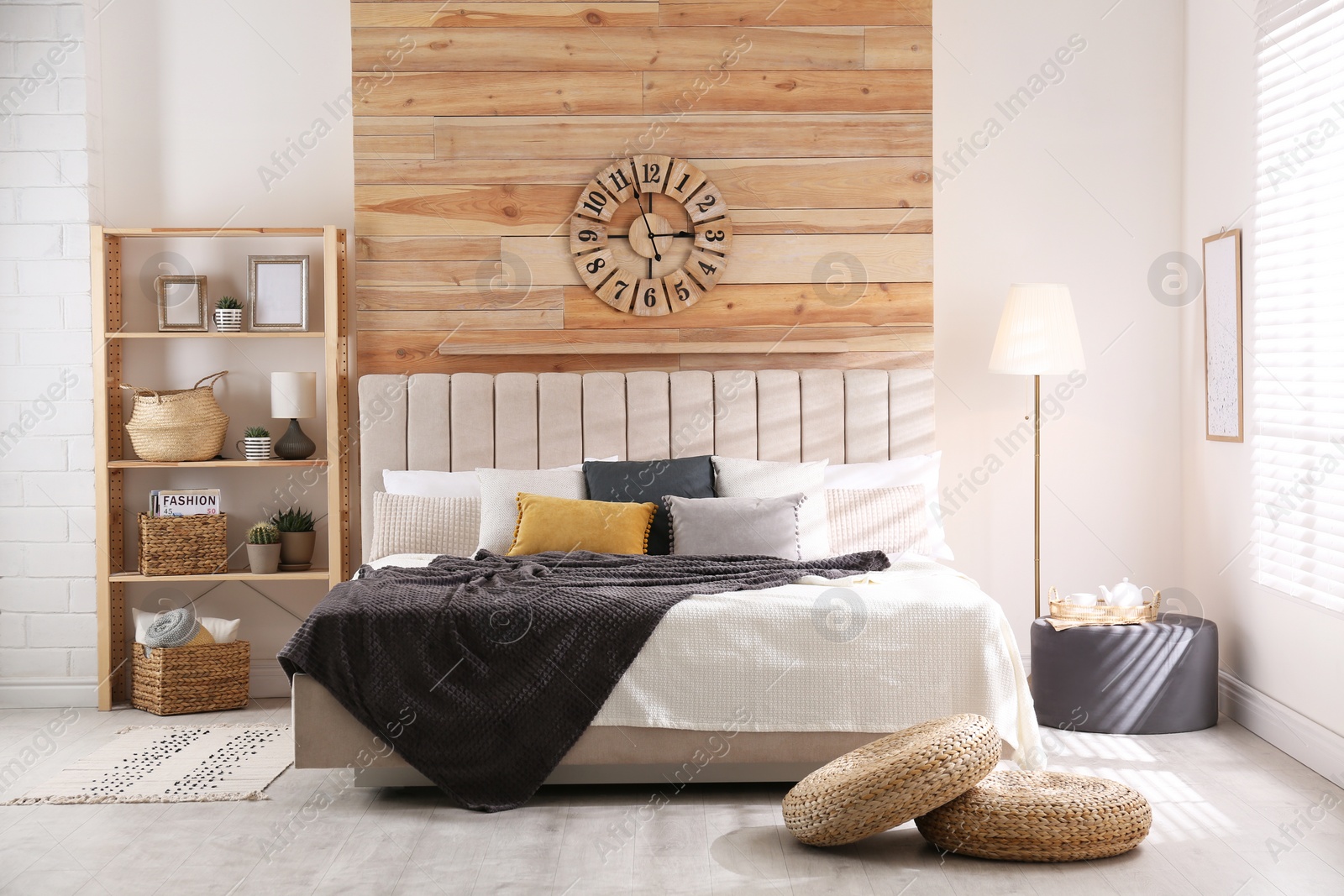 Photo of Stylish room interior with big comfortable bed