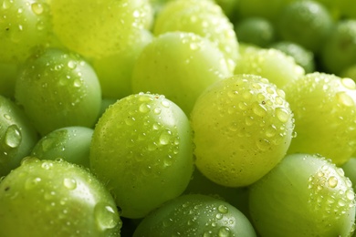 Photo of Bunch of green fresh ripe juicy grapes as background, closeup