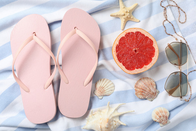 Photo of Beach objects on blanket as background, flat lay