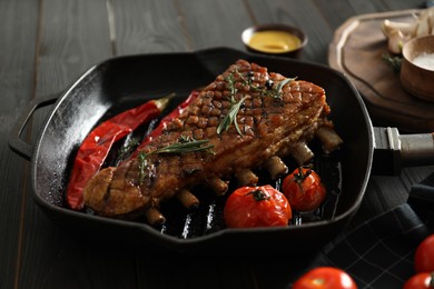 Delicious roasted ribs served on wooden table