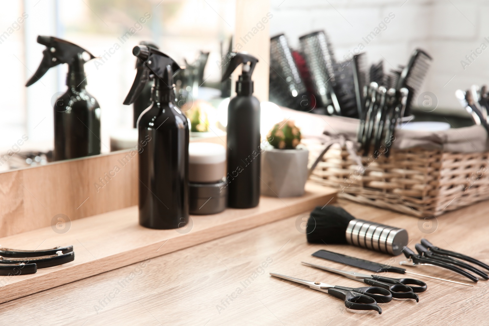 Photo of Hairdresser tools on table in salon