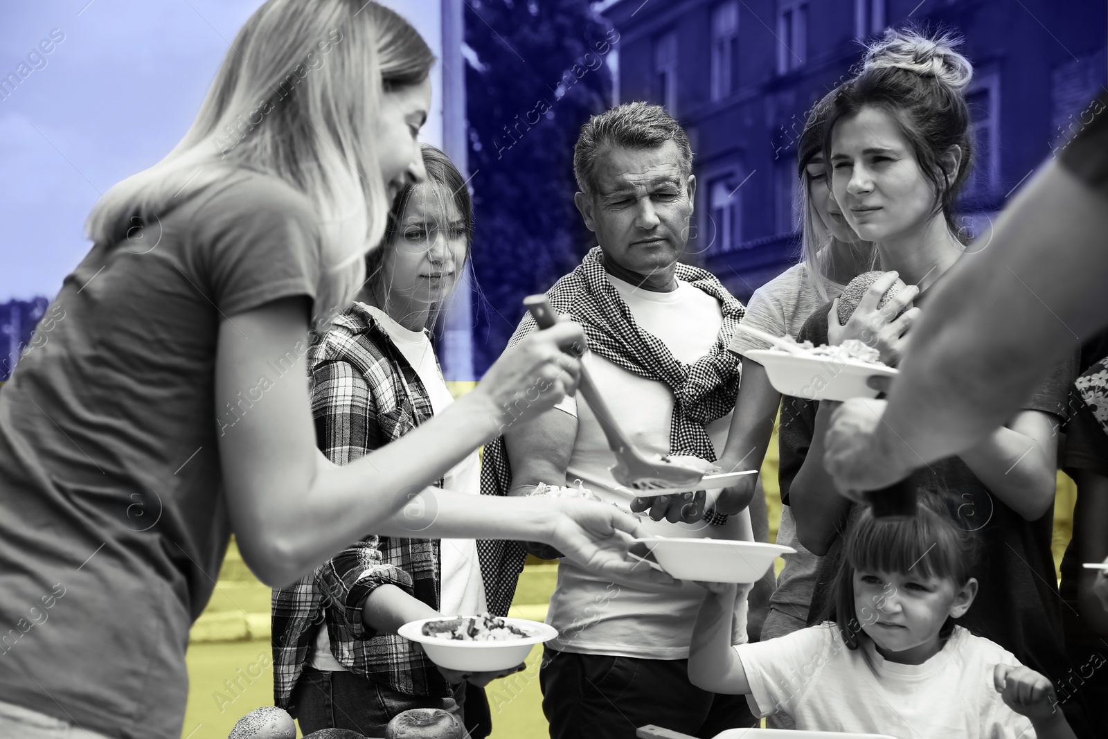 Image of Double exposure of volunteers serving food to refugees and Ukrainian flag, black and white effect. Help during war