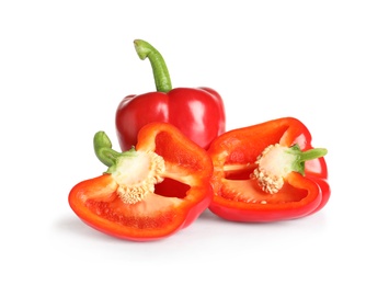 Photo of Cut and whole ripe red bell peppers on white background