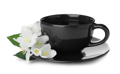 Photo of Cup of tea and fresh jasmine flowers isolated on white