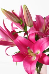 Photo of Beautiful pink lily flowers on white background, closeup