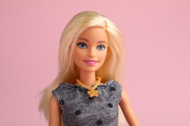 Mykolaiv, Ukraine - September 2, 2023: Beautiful Barbie doll on pale pink background