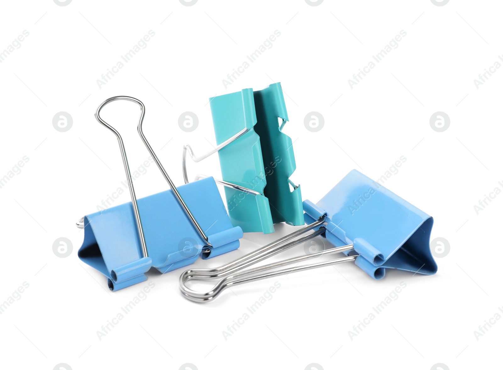 Photo of Colorful binder clips on white background. Stationery