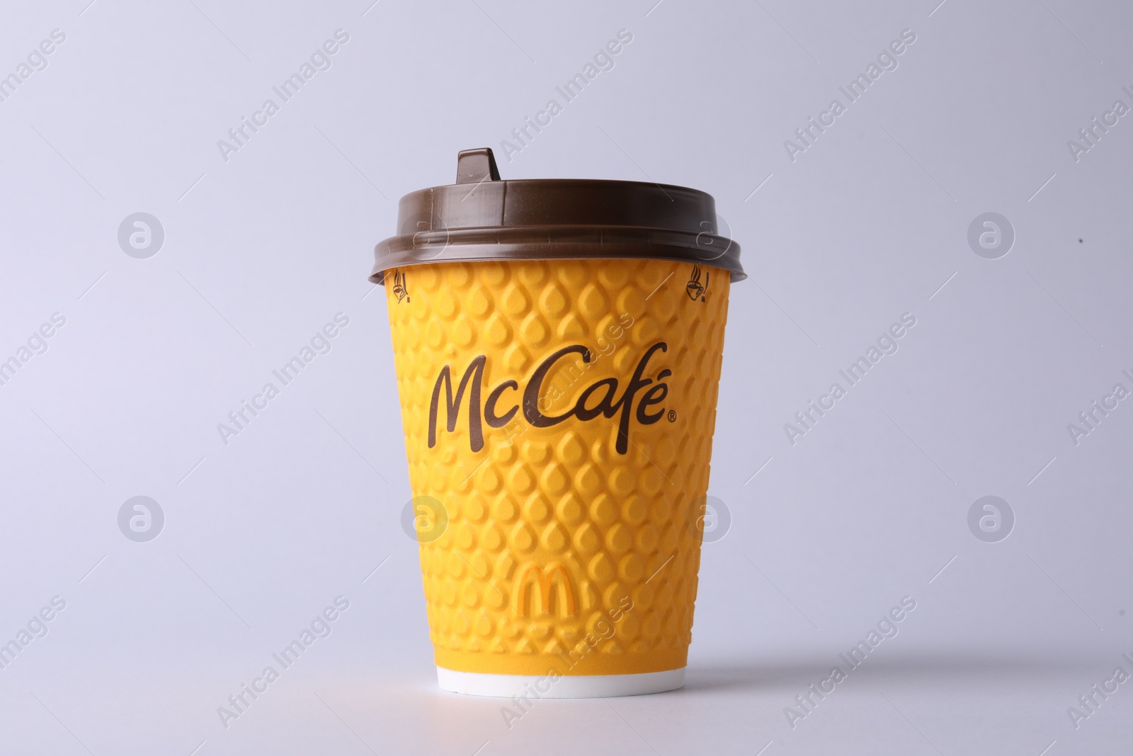 Photo of MYKOLAIV, UKRAINE - AUGUST 12, 2021: Hot McDonald's drink on light background