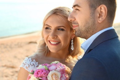 Wedding couple. Bride and groom on beach