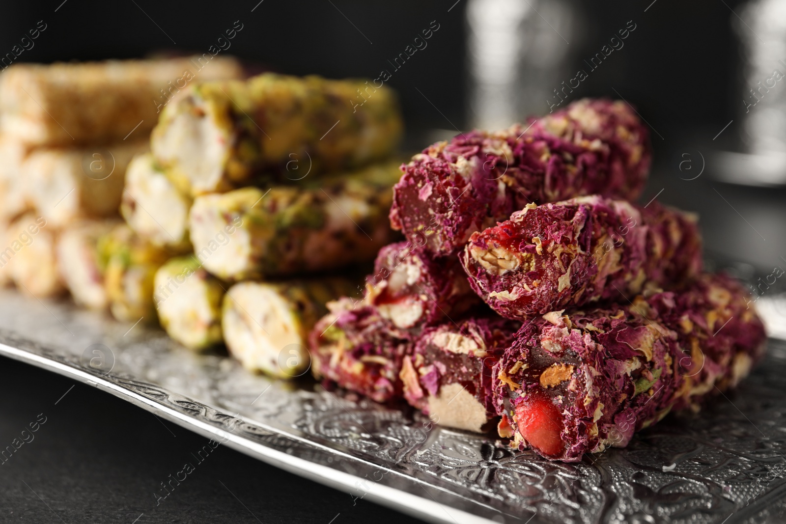 Photo of Turkish delight dessert on tray, closeup. Traditional sweet