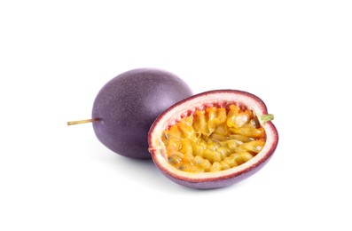 Photo of Cut and whole passion fruits on white background