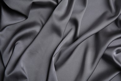 Photo of Texture of delicate black silk as background, top view