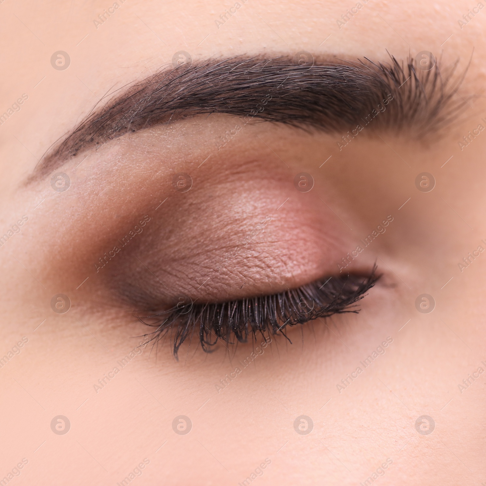 Photo of Woman with beautiful makeup created by professional artist. Focus on eye