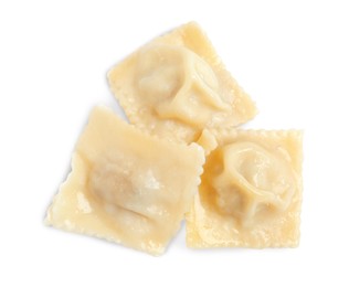 Boiled ravioli with tasty filling on white background, top view