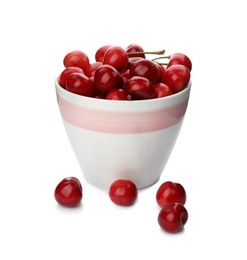 Photo of Bowl with sweet red cherries on white background