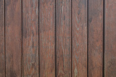 Photo of Texture of brown wooden planks as background
