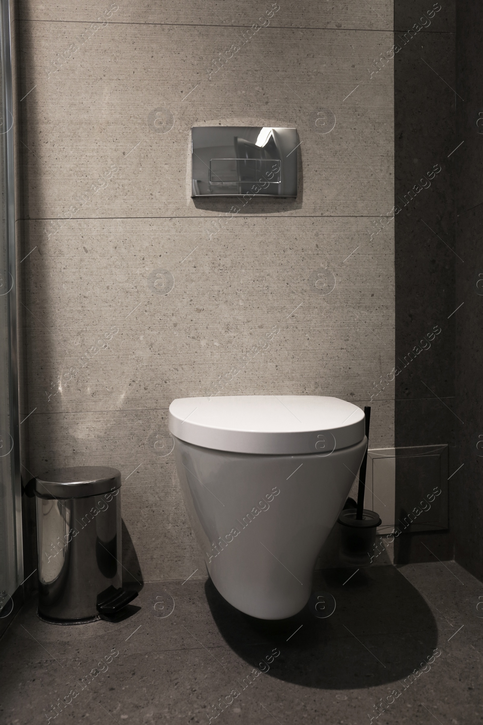 Photo of New modern toilet bowl in bathroom interior