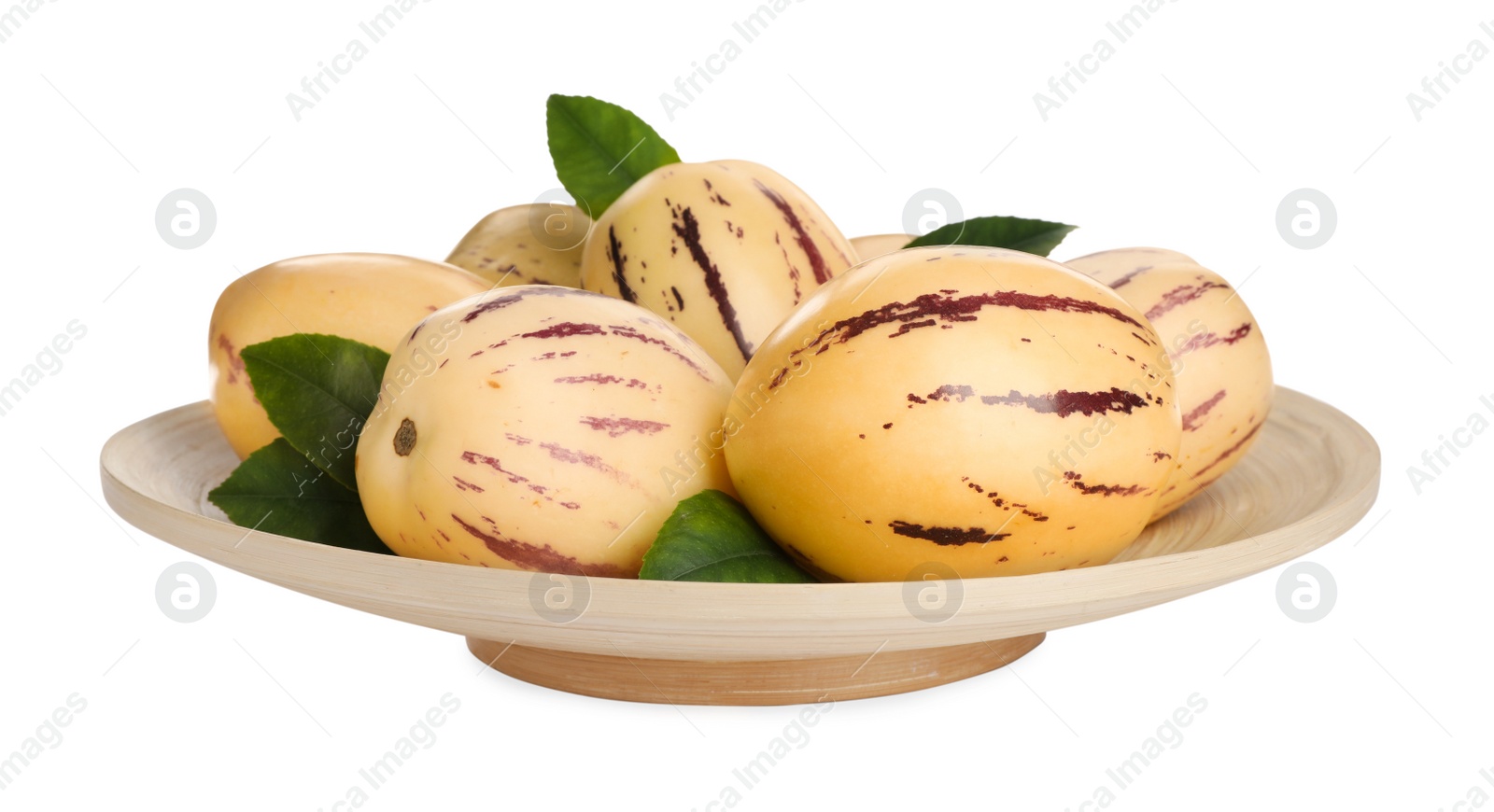 Photo of Plate with fresh ripe pepino melons and green leaves on white background