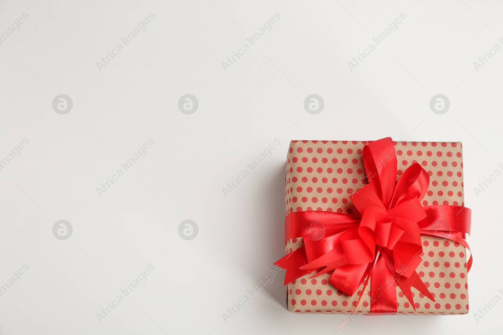 Photo of Beautifully decorated gift box on white background, top view