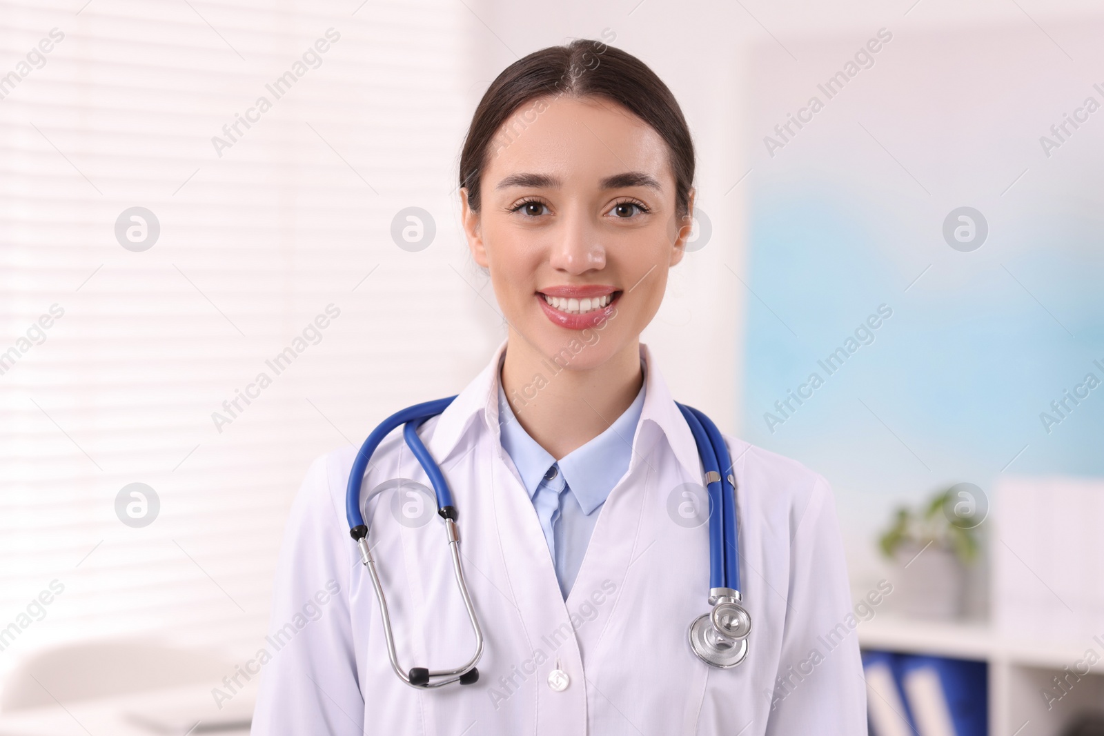 Photo of Portrait of medical consultant with stethoscope in clinic