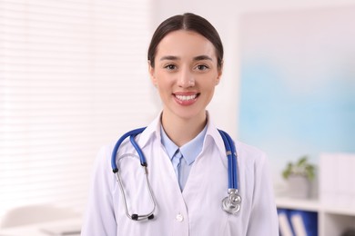 Portrait of medical consultant with stethoscope in clinic