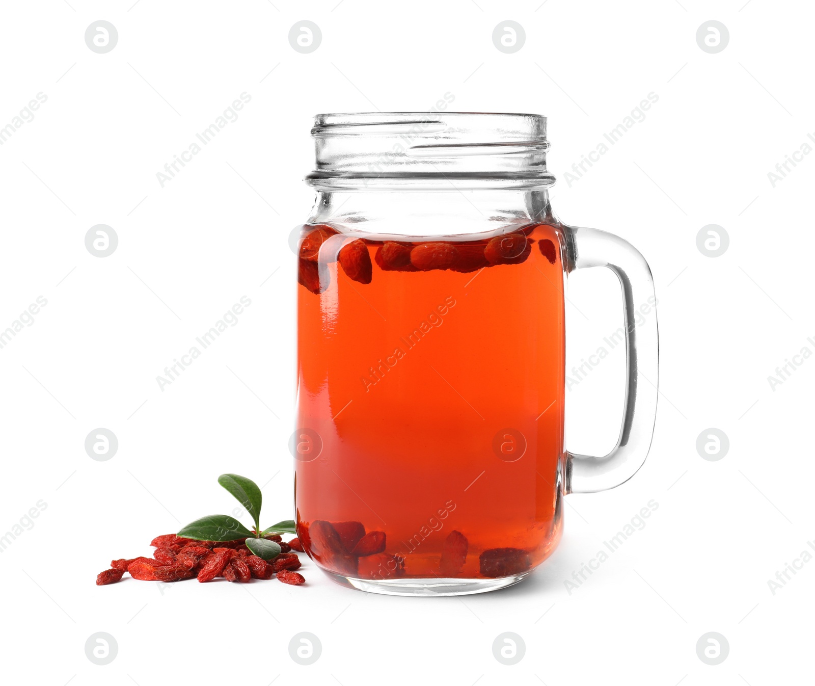 Photo of Healthy goji juice in mason jar with berries on white background