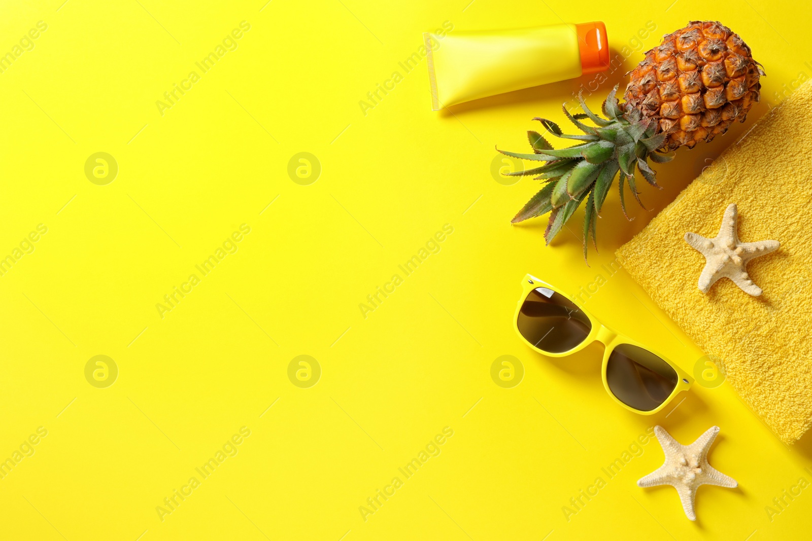 Photo of Flat lay composition with beach accessories on color background. Space for text