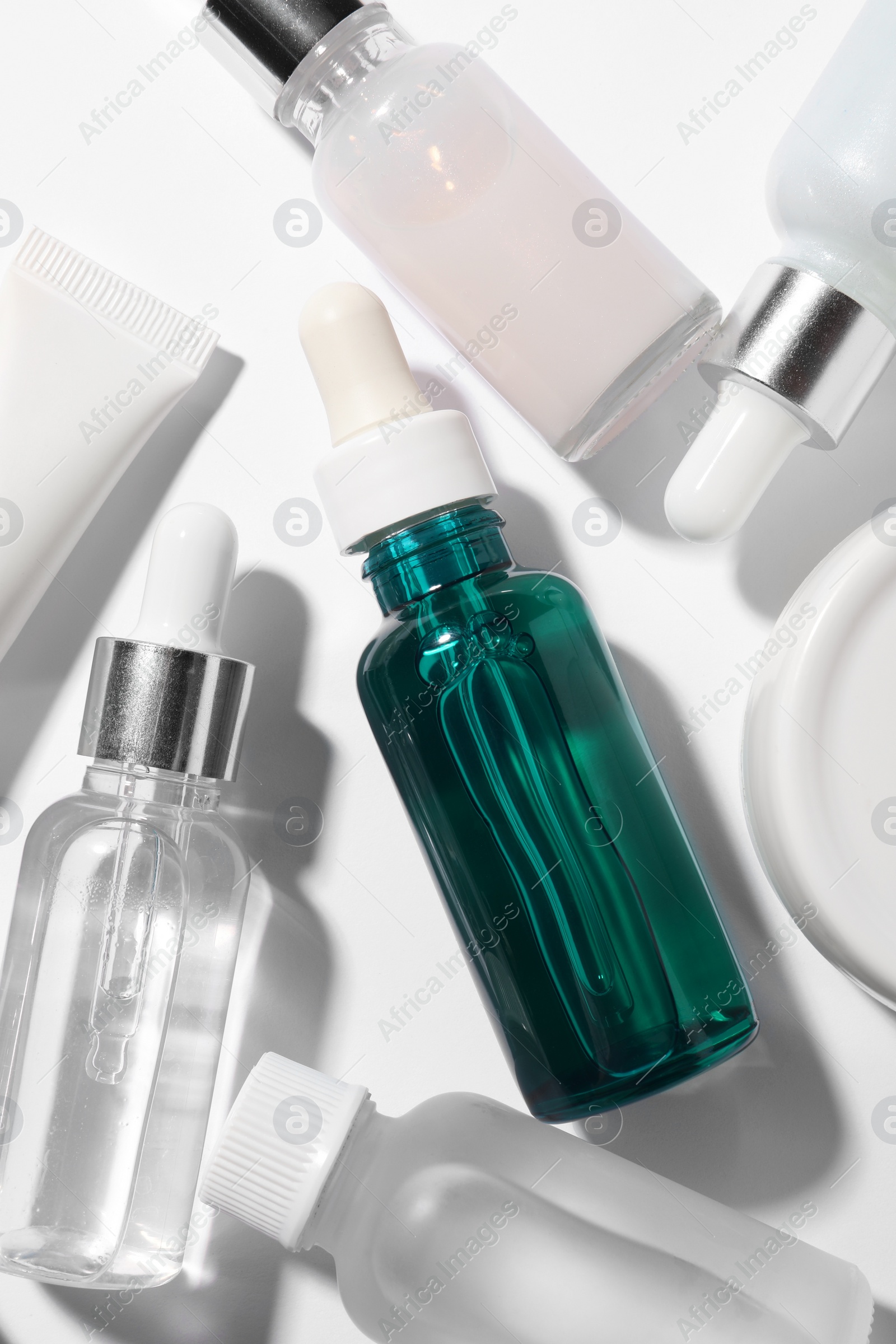 Photo of Cosmetic serum on white background, flat lay
