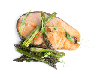 Photo of Tasty salmon steak with asparagus isolated on white, top view