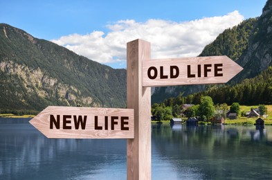 Image of Alcohol addiction: what to choose - life with old bad habits or new good ones? Wooden signpost with different directions against beautiful mountain landscape