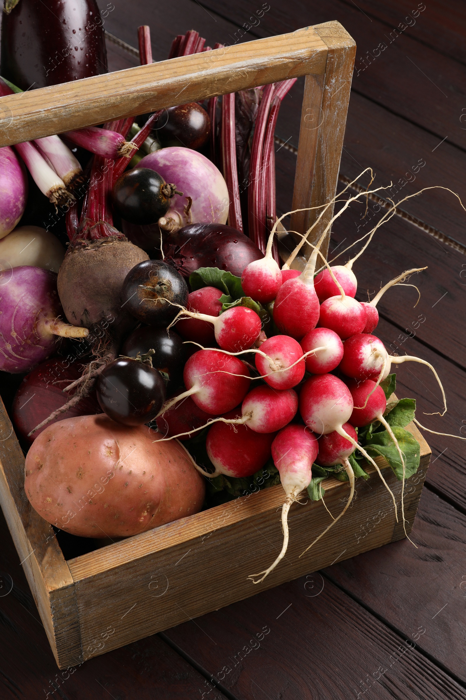 Photo of Different fresh ripe vegetables on wooden table