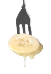 Banana with chocolate on fondue fork against white background