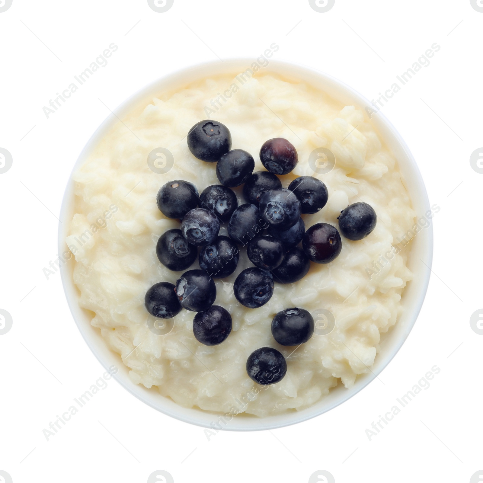 Photo of Delicious rice pudding with blueberries isolated on white, top view